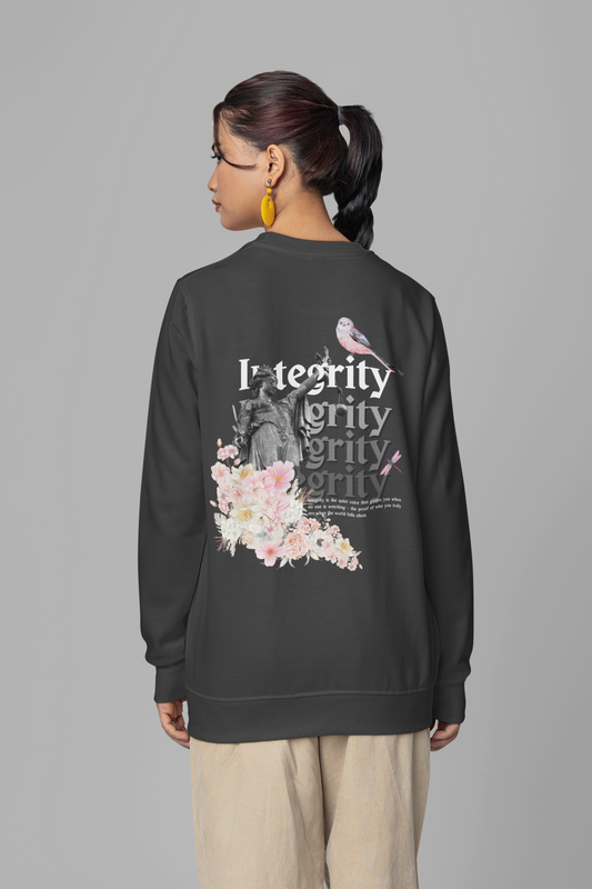 Person wearing a black sweatshirt with floral and text design on a gray background